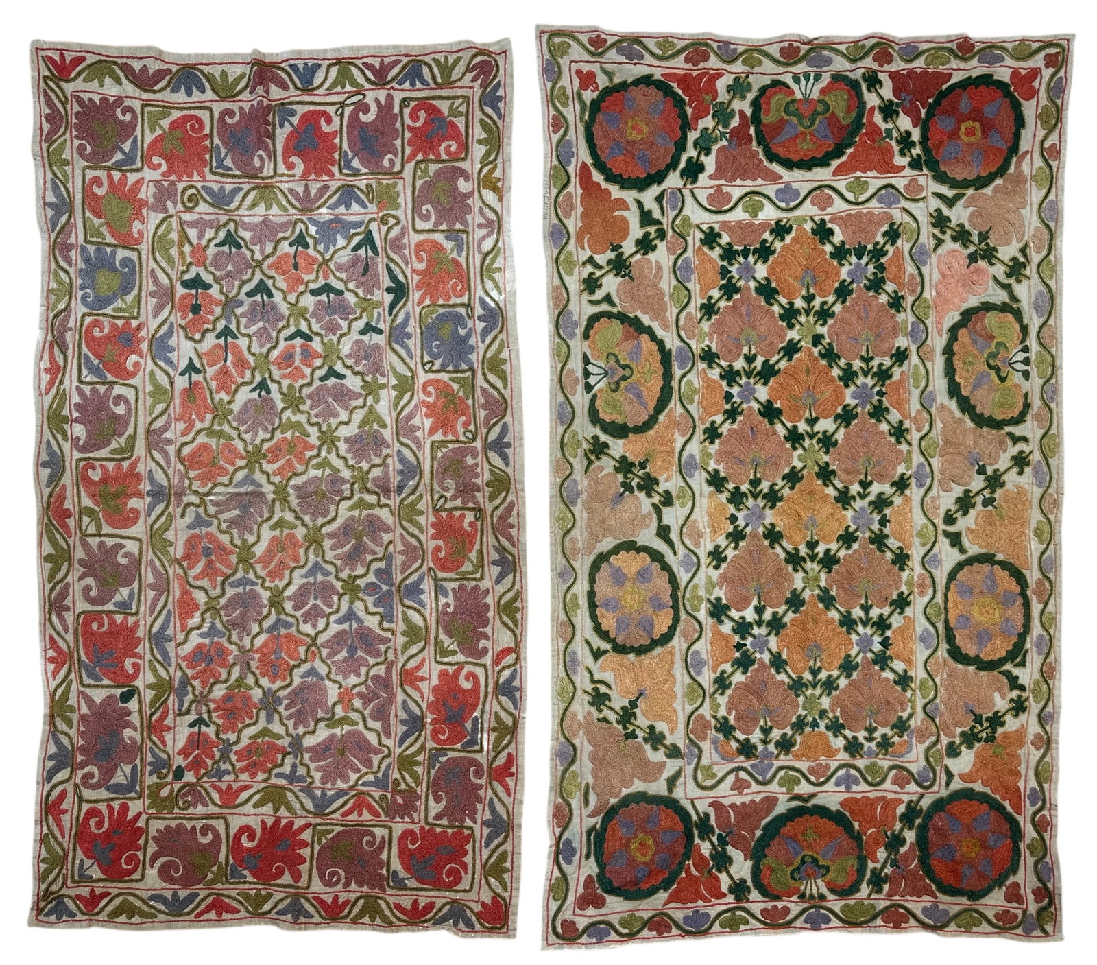 Two Vintage Suzani Silk On Cotton Foundation Circa 2000: Two Vintage Suzani Silk On Cotton Foundation Circa 2000. size: 147 cm x 84 cm (58 ins x 33 ins) size: 144 cm x 78 cm (56 ins x 32ins). TORG AUCTIONS offers bespoke packing and international and domest