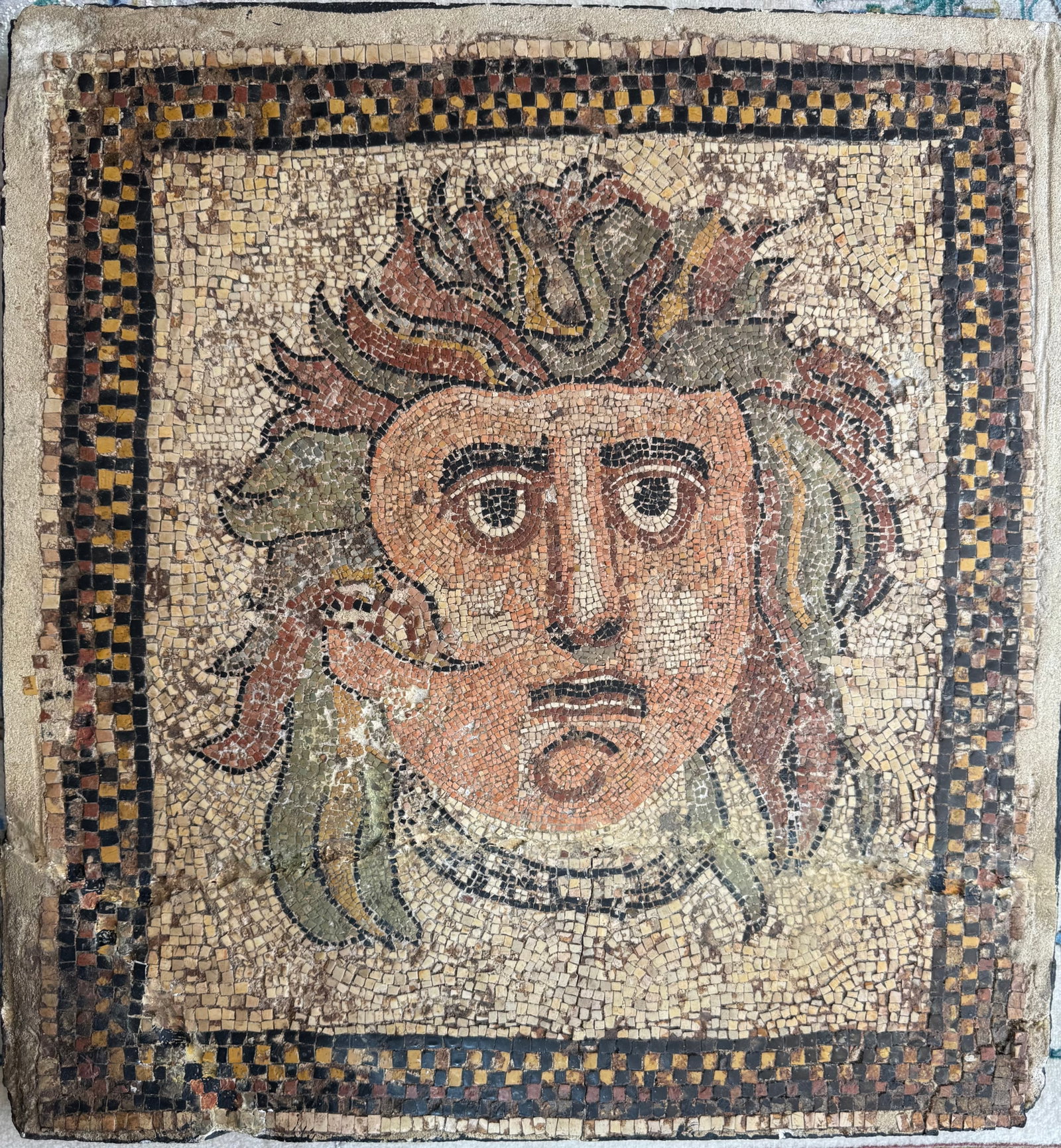 Antique North African Greco-Roman Mosaic With Medusa' Face Circa AD 115-150: Antique North African Greco-Roman Mosaic With Medusa' Face Circa AD 115-150. Size: 56 cm x 52 cm x 3cm (22 ins x 20.5 ins x 1 ins). TORG AUCTIONS offers bespoke packing and international and domestic 