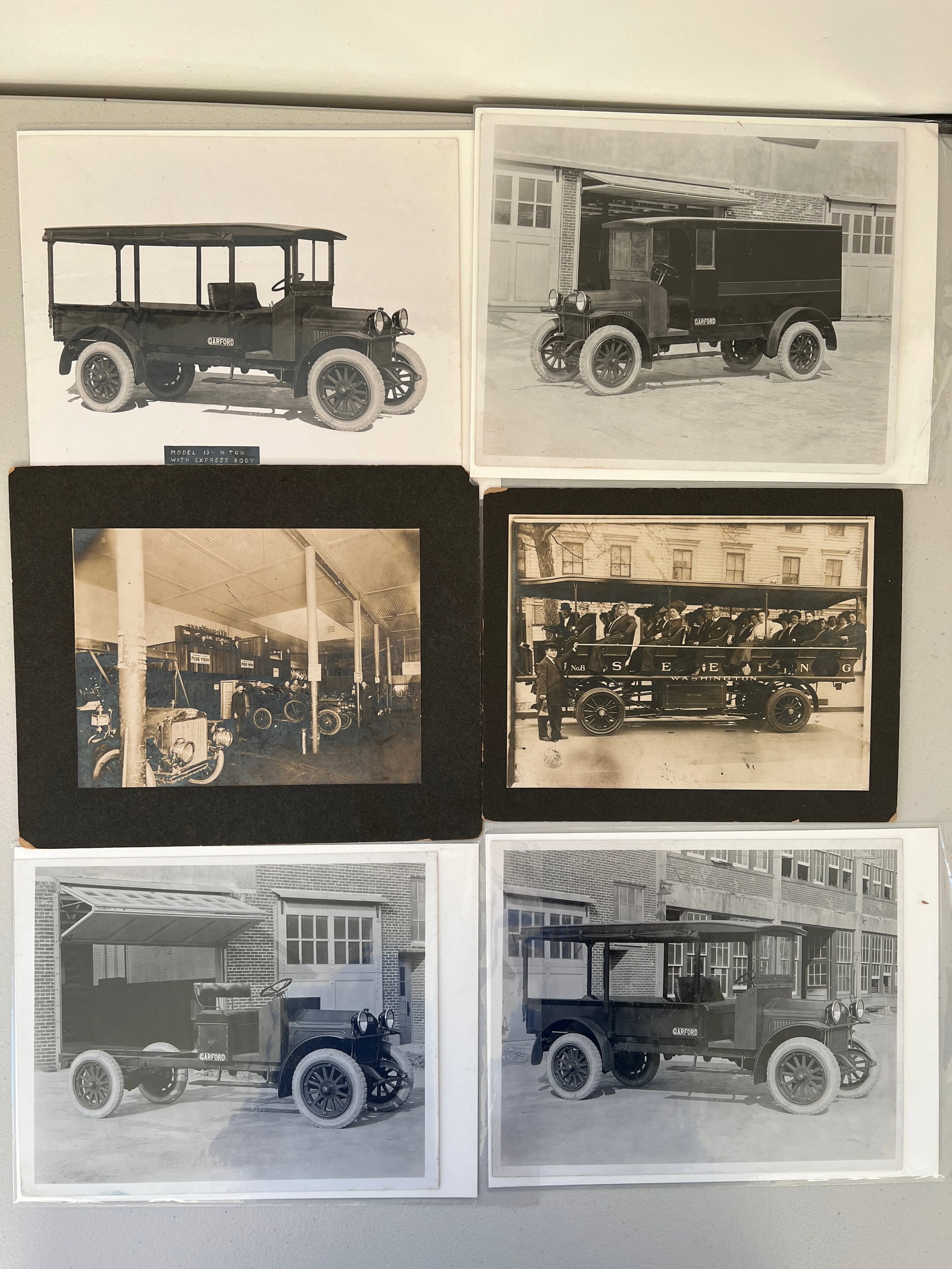 Lot of 6 antique photos including Garford Truck promotional pics, a Fisk tire garage & seeing trolly: A lot of 6 antique photos - 4 of which are a collection of black and white photographs from the Garford Motor Truck Company's advertising department showing the internal "Photograph No." and "File No.