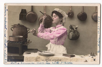 La Petite Cuisinière: Young Woman in Pink Blouse Cooking at Stove, Early 20th Century Postcard