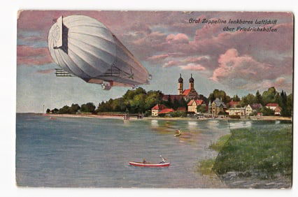 Graf Zeppelin airship flying over Friedrichshafen, lakeside town view, early 20th century.