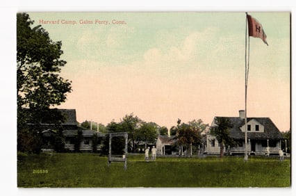 Colorized view of Harvard Camp, Gales Ferry, Conn., with buildings and a prominent Harvard flag.