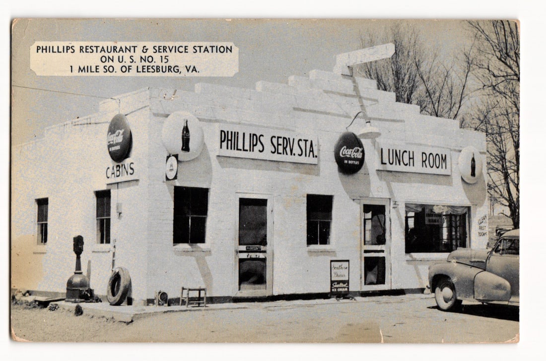 Phillips Restaurant & Service Station, U.S. No. 15, Leesburg, Virginia, Mid-Century Roadside: The front of the postcard features a black and white photograph of the Phillips Restaurant & Service Station. The image is captioned in the upper left corner with white sans-serif text: "PHILLIPS REST