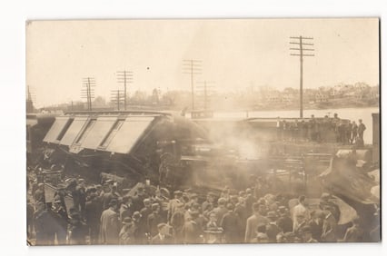 Train Wreck Aftermath: Derailed Cars and Crowd of Onlookers by River, Early 20th Century RPPC