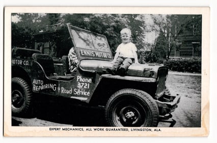 Young Child Seated on Hood of Ennis Motor Co. Jeep, Auto Repairing & Road Service, Livingston, ALA.