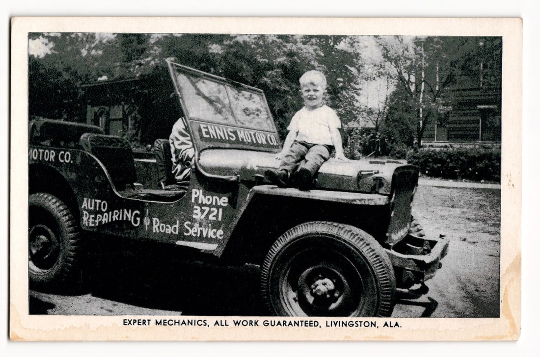 Young Child Seated on Hood of Ennis Motor Co. Jeep, Auto Repairing & Road Service, Livingston, ALA. (1 of 2)