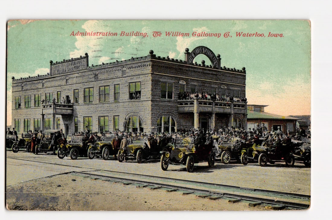 Administration Building, The William Galloway Co., Waterloo, Iowa; Early Automobiles & Crowd.: The front of the postcard features a colorized photograph of the "Administration Building, The William Galloway Co." in Waterloo, Iowa. The image depicts a large, multi-story stone or brick building w