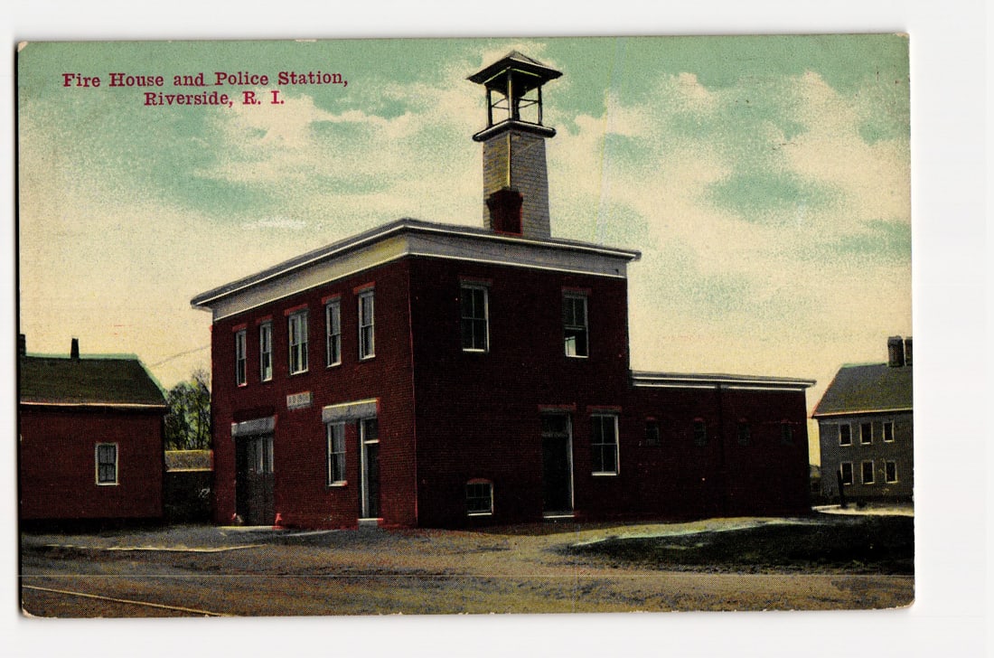 Fire House and Police Station, Riverside, R. I., Two-Story Brick Building with Bell Tower: The front of the postcard features a colorized photograph of a two-story brick building, identified as the Fire House and Police Station. The building has a flat roof with a prominent bell tower risin