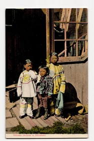 Colorized Postcard: Three Chinese Children in Chinatown, Standing by Wooden Building Exterior