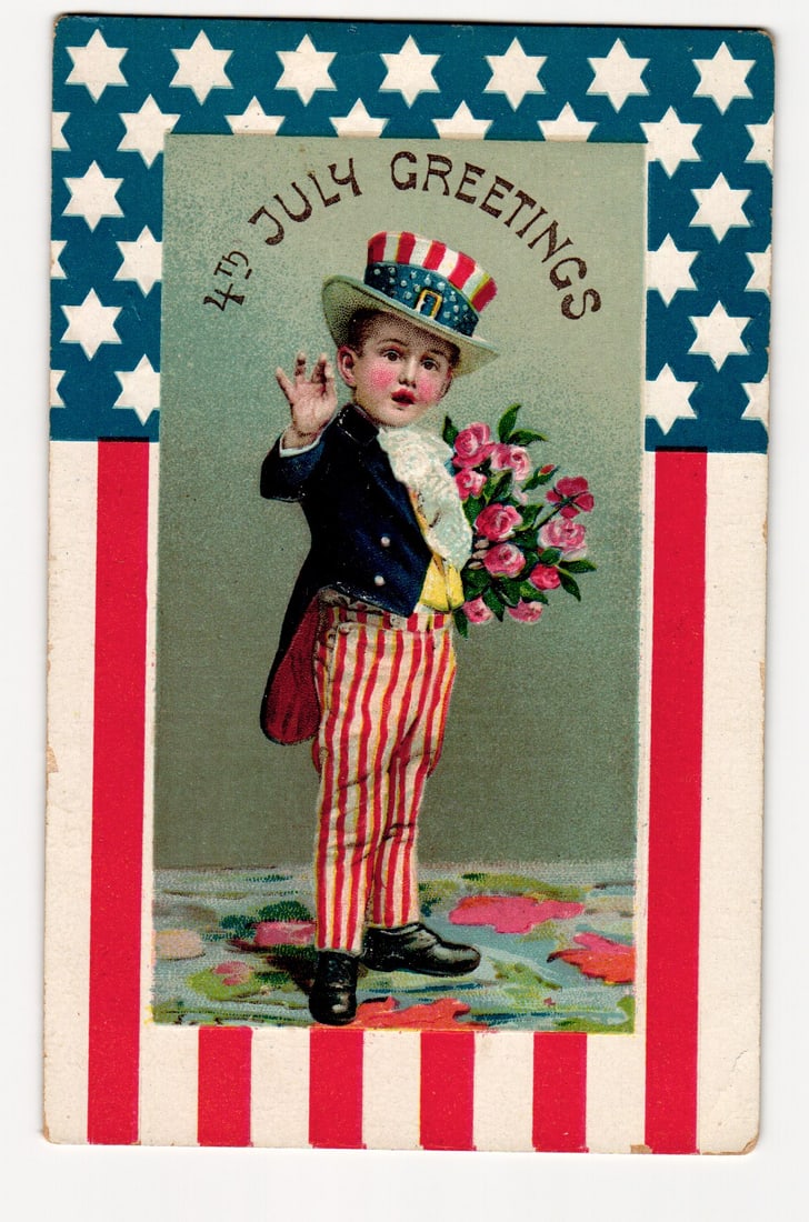 Early 20th C. Illustrated Postcard: Boy, Patriotic Costume, 4th July Greetings, Flag Border: An illustration shows a young boy in patriotic attire: a top hat adorned with stars and stripes, a blue tailcoat, a yellow waistcoat with a ruffled white jabot, and red-and-white vertically striped tr