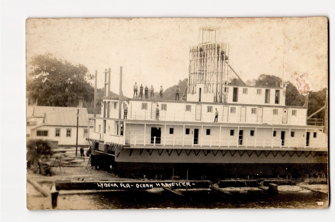 Real Photo Postcard: Lybeck, FL, Ocean Harvester Boat, Workers on Deck, Waterside View (1 of 2)