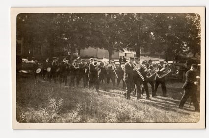 Real Photo Postcard: Marching Band at Fire Men's Muster, Ashland, N.H., Early 20th Century.