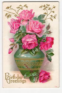 Antique Birthday Greetings Postcard: Pink Roses in Ornate Green Vase with Gold Embellishments: The front of this embossed chromolithograph postcard features an arrangement of pink roses in varying shades, some fully bloomed and others as buds, set within a green, textured vase. The vase is ador