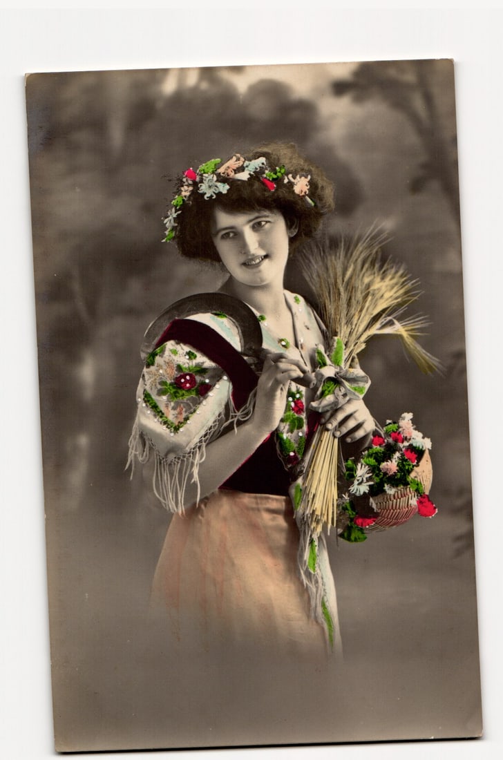 Antique Postcard of a Woman in Traditional Attire with Wheat, Flowers, and Sickle, Hand-Tinted (1 of 2)