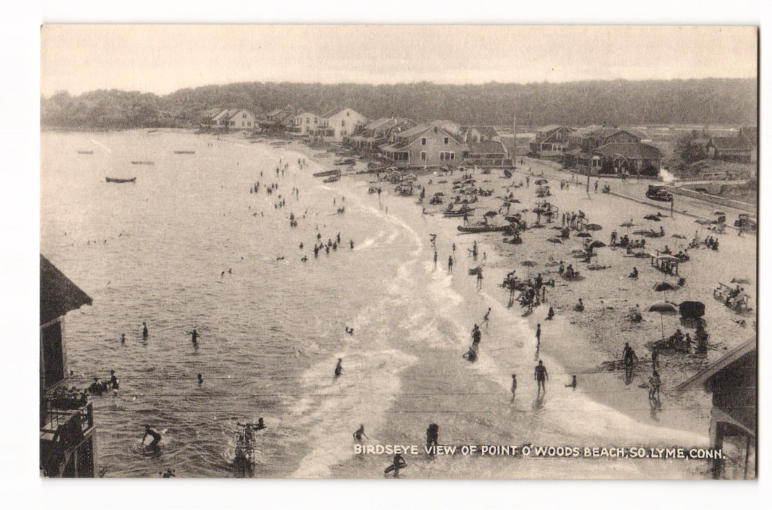 Birdseye View of Point O' Woods Beach, South Lyme, Conn. Sepia Collotype Postcard: A sepia-toned photograph presenting a high-angle, birdseye view of Point O' Woods Beach in So. Lyme, Conn. The beach is populated with numerous people, some swimming in the ocean, others gathered on t