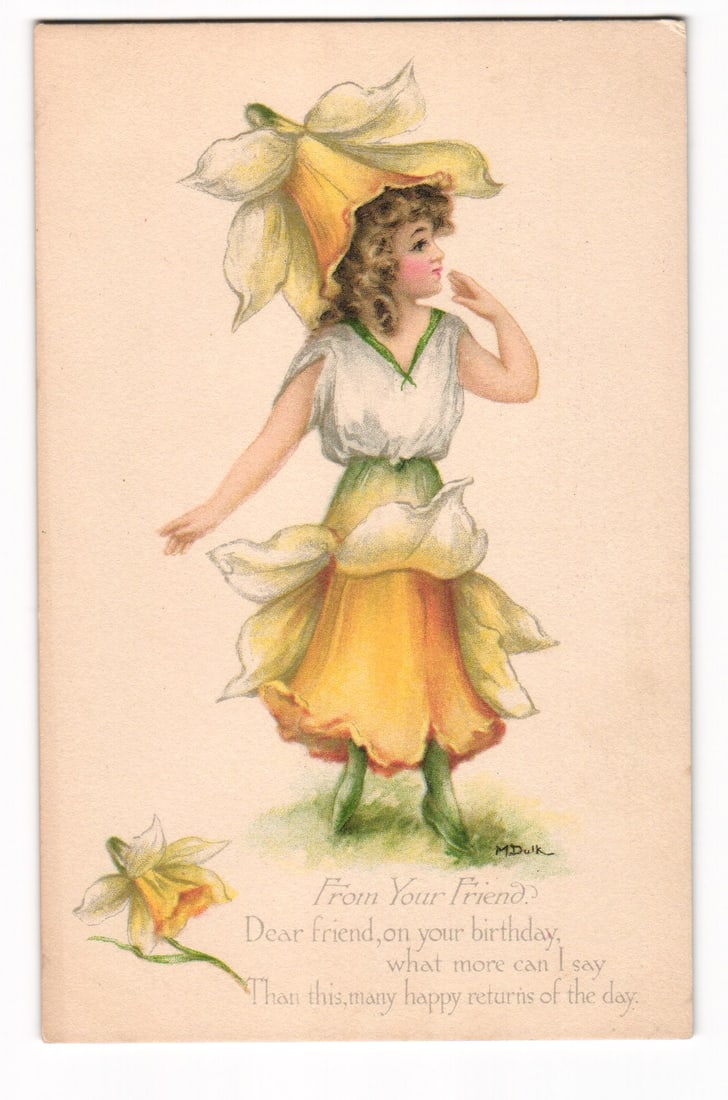 Antique Birthday Postcard: Woman as Daffodil Flower, Gibson Art Co. Cincinnati, M. Dwlk Artist: An illustration depicts a young woman adorned in a costume resembling a daffodil. Her hat is a large, yellow and white daffodil bloom, her bodice is white with green trim and a green waistband, and he