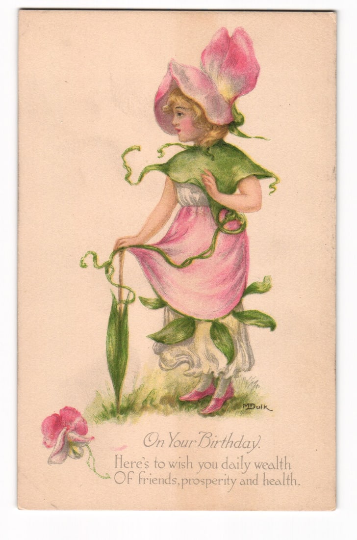 Illustrated Birthday Postcard: Woman as Sweet Pea Flower, M.D.Quik Art, Gibson Art Co.: An illustration depicts a young woman standing in profile, facing left, against a plain light beige background. She is attired in a costume evoking a sweet pea flower: a large pink petal serves as a h