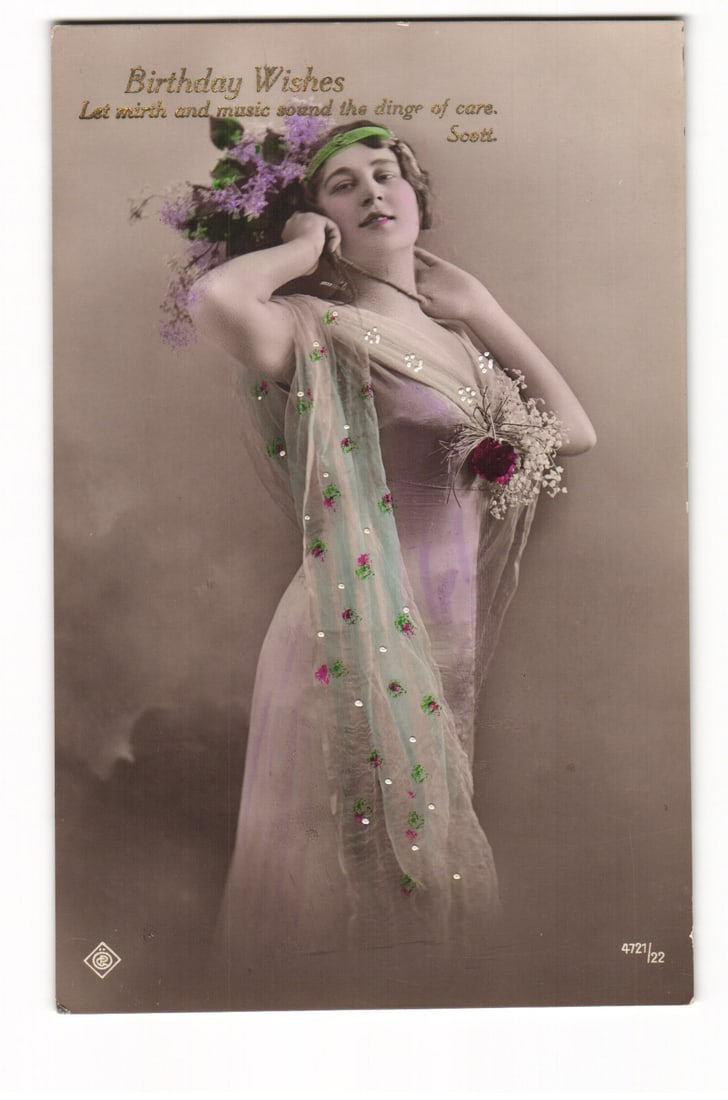 Art Nouveau Style Birthday Wishes Postcard: Woman with Flowers, Embellished Scarf, Scott Quote: A color-tinted photographic postcard: woman in three-quarter portrait. She holds purple/white flowers behind her head, other hand at neck. Wears light sheer gown, blue-green shawl with floral motifs/b