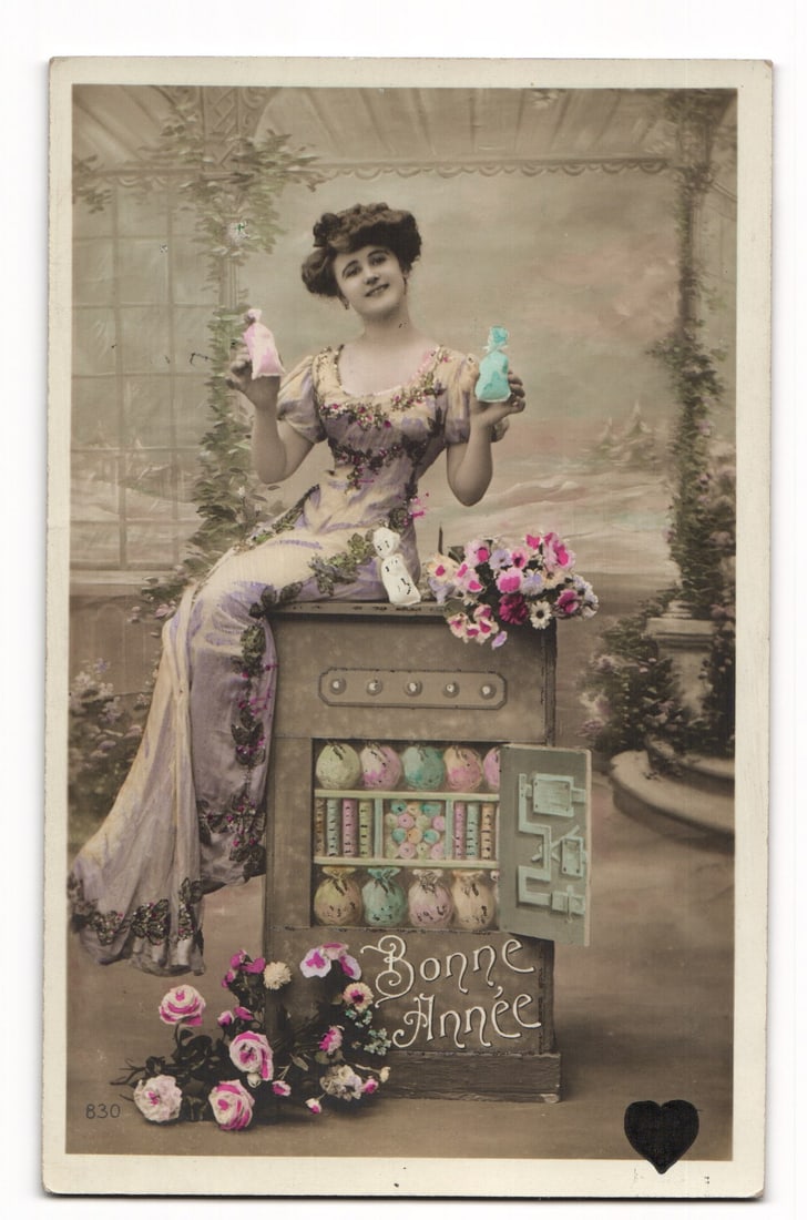 French "Bonne Année" New Year postcard: Woman with figurines, cabinet, flowers, Paris address (1 of 2)