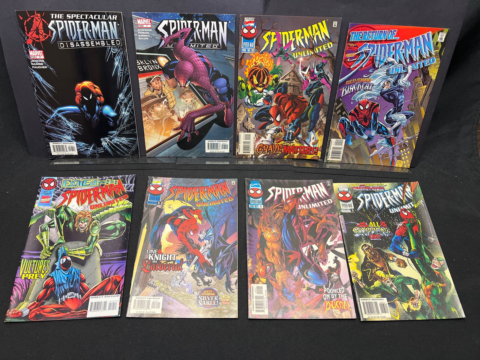 Lot of Assorted Spider-Man Comic Books, including Spider-Man Unlimited and Spectacular issues: This collection features a group of Spider-Man comic books, predominantly from the *Spider-Man Unlimited* series with issues such as #10 ("Exiled Part 4 of 4"), #11 ("The Return of the Black Cat!"), #