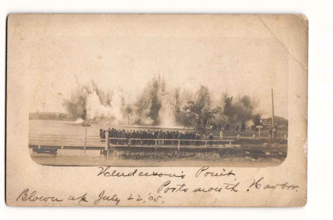 RPPC Postcard: Henderson's Point Explosion, Portsmouth Harbor NH, Viewed by Crowd, July 22, 1905: A sepia-toned real photo postcard. The image captures a large explosion in Portsmouth Harbor off the coast of Porstmouth, New Hampshire and Kittery, Maine, with a significant plume of water, smoke, an