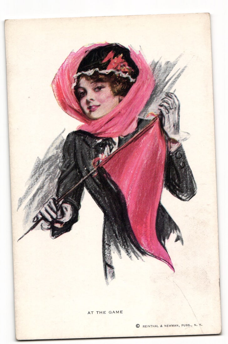 Early 20th C. Woman with Pink Pennant, "At The Game" by Reinthal & Newman, N.Y. postcard: An illustration depicts a woman from the waist up, facing three-quarters to the left, with her head turned to look towards the viewer. She wears a dark hat adorned with a red floral element and white