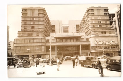 Real Photo Postcard: Trans-Lux Prado Building, Street View with Vintage Cars, Mid-Century
