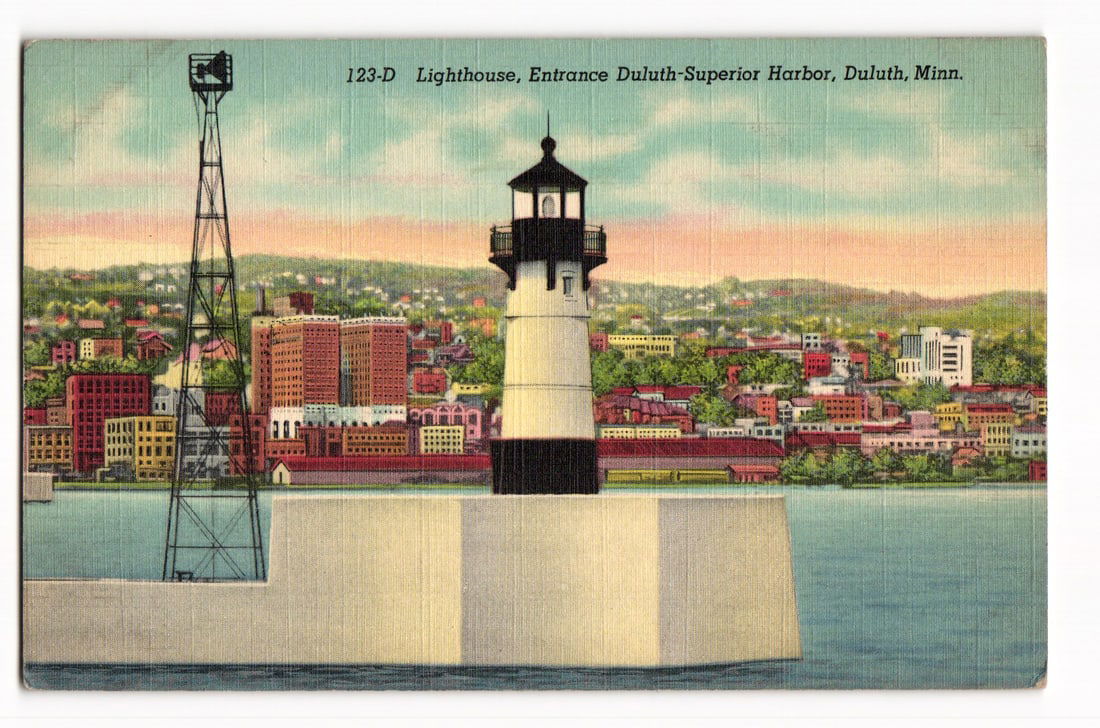 Lighthouse at Entrance Duluth-Superior Harbor, Duluth, Minn., C.T. Art-Colortone Postcard: Color illustration: lighthouse (white, black band/lantern) on concrete pier. Steel lattice tower left. Background: cityscape, hilly shore, pastel sky. Blue foreground water. Text: "123-D Lighthouse, E