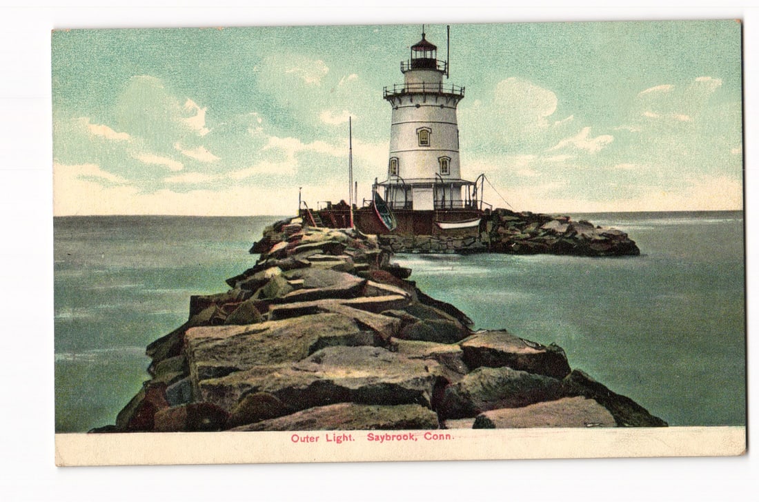 Outer Light, Saybrook, Connecticut, Lighthouse on Jetty, Early 20th Century Litho-Chrome Postcard: A view from the landward end of a long, rocky jetty leads towards the Outer Light lighthouse in Saybrook, Connecticut. The white, octagonal lighthouse tower features multiple windows, a lantern room,