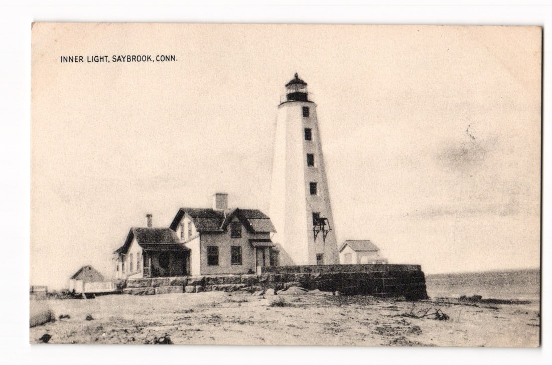 Inner Light Lighthouse, Saybrook, Conn. View with Buildings, Collotype Co. Postcard Print: A sepia-toned photographic depiction of the Inner Light lighthouse complex in Saybrook, Connecticut. The prominent white, octagonal lighthouse tower, featuring multiple windows and a lantern room, sta