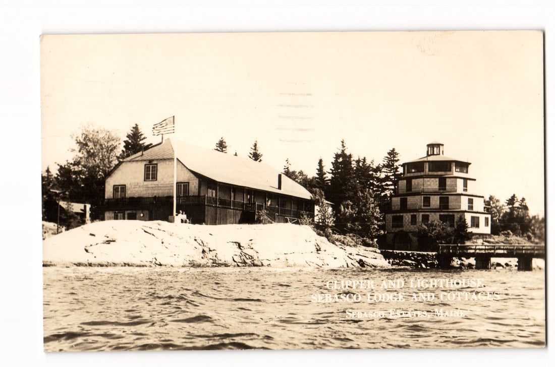 Clipper and Lighthouse, Sebasco Lodge and Cottages, Sebasco Estates, Maine 1949 Postcard: A sepia-toned photograph shows the "Clipper" building, a long, gabled structure with a porch and an American flag, and the "Lighthouse," a cylindrical, multi-story building, both part of Sebasco Lodge