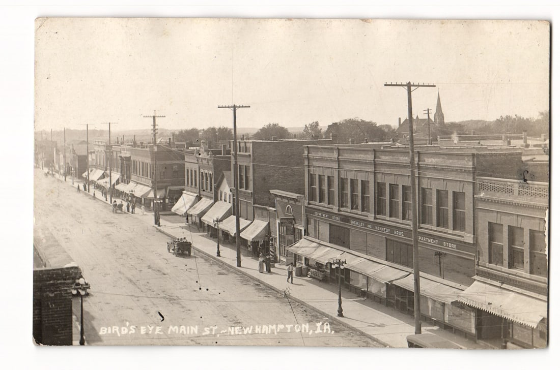Bird's Eye Main St., New Hampton, IA. Real Photo Postcard, Sheakley & Kennedy Bros. Store, 1922 (1 of 2)