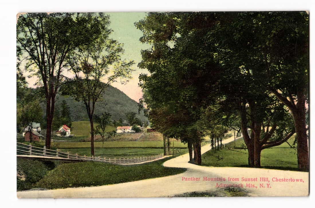 Panther Mountain from Sunset Hill, Chestertown, Adirondack Mts., N.Y. scenic road postcard c.1912: Color lithograph postcard depicting a tree-lined, winding dirt or gravel road receding into the distance. On the right, large, mature deciduous trees with dense foliage overhang the road. On the left,