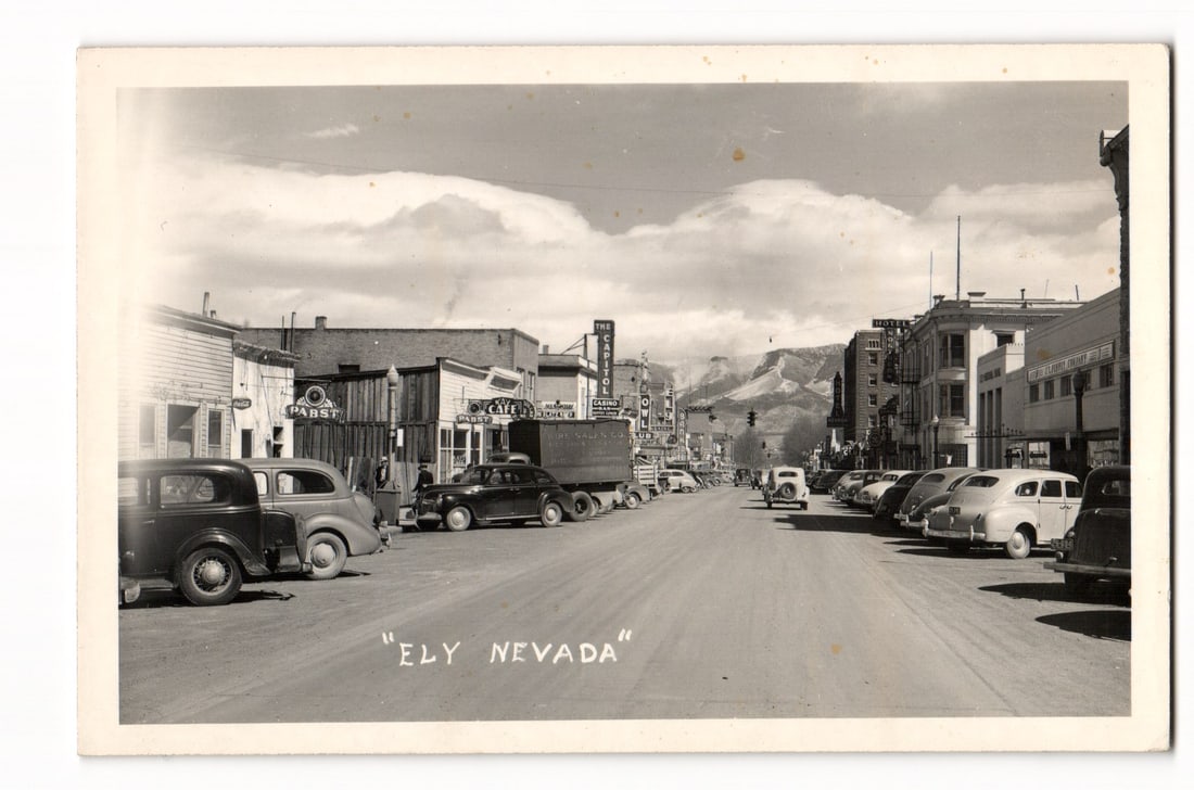 Ely, Nevada Main Street View with Vintage Automobiles and Distant Mountains, RPPC Postcard (1 of 2)