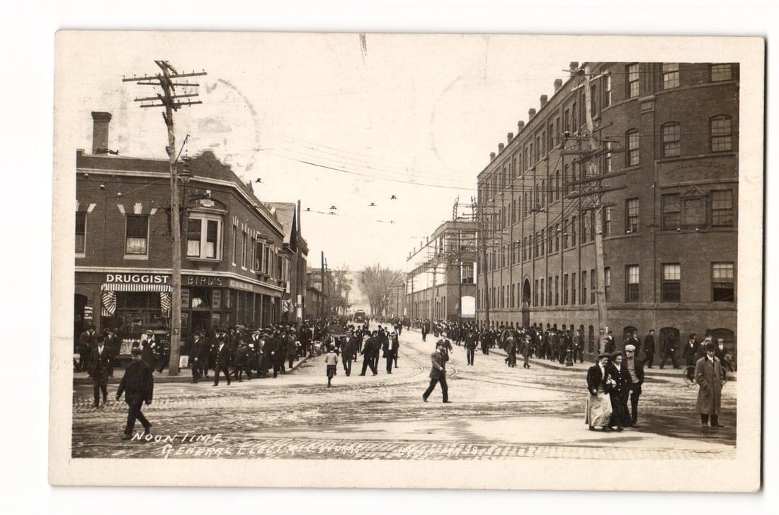 Lynn, Mass. Noon-Time General Electric Works, Street Scene with Pedestrians, Vintage Postcard: A photographic street scene depicting "Noon-Time" at the General Electric Works in Lynn, Massachusetts. Numerous pedestrians, predominantly men in period attire with some women and at least one child,