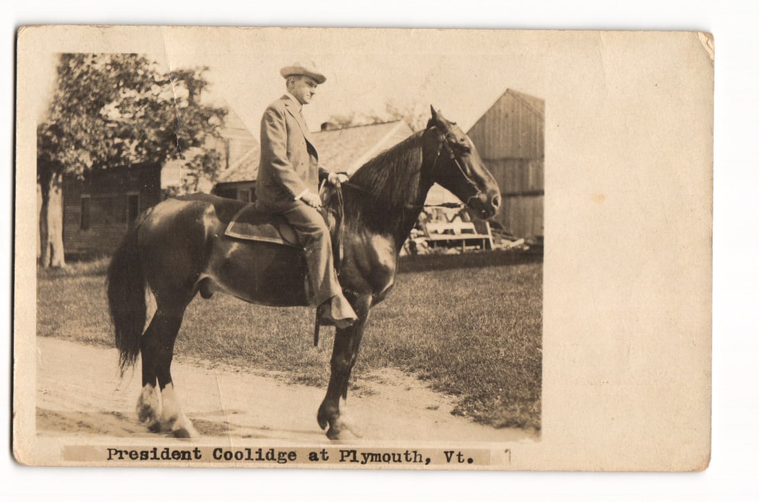 President Coolidge on Horseback at Plymouth, Vt. Real Photo Postcard, Circa 1924 Postmark: A sepia-toned Real Photo Postcard (RPPC). The image features a man, identified by printed text below the image as "President Coolidge," seated on a dark horse, facing right in profile. He is wearing a