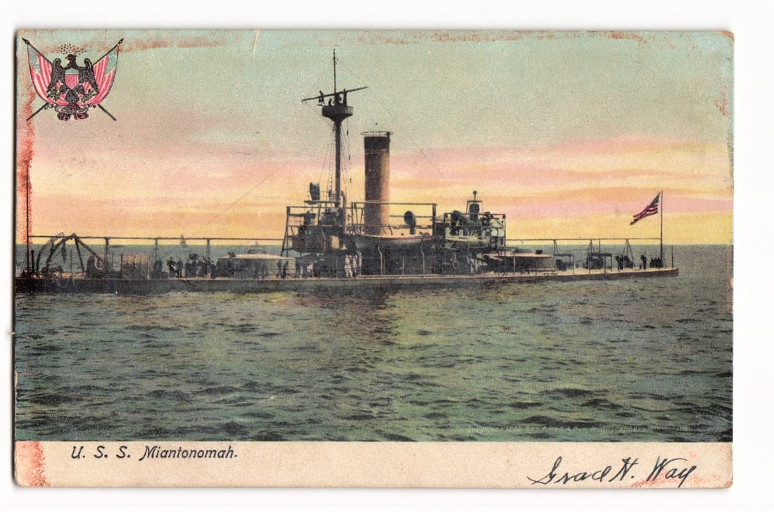 U.S.S. Miantonomah Naval Warship at Sea, American Insignia, Early 20th Century Postcard: A color lithograph postcard depicting the U. S. S. Miantonomah, a naval warship, viewed from its port side as it travels on choppy water. The sky is rendered in pastel hues of pink, yellow, and light