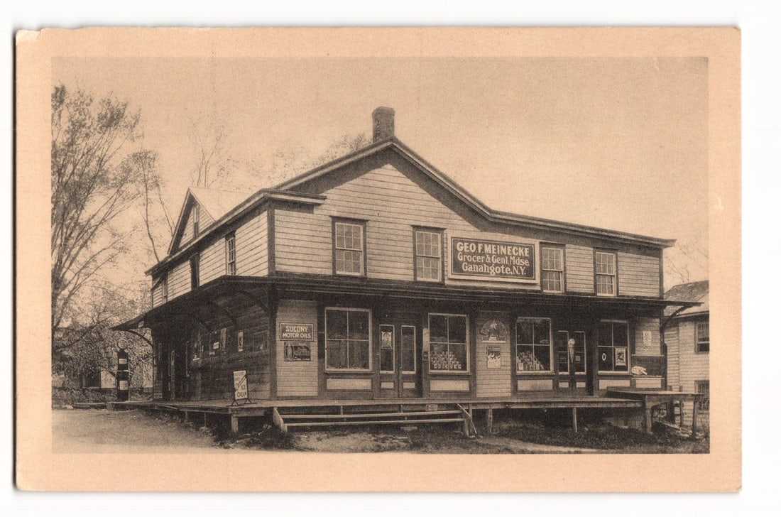 Postcard of Geo F. Meinecke Grocer & Genl Mdse., Canajoharie, N.Y. with Socony Motor Oils Sign (1 of 2)