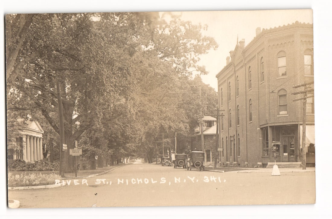River St., Nichols, N.Y. early 20th C. street scene with automobiles, classical building postcard (1 of 2)