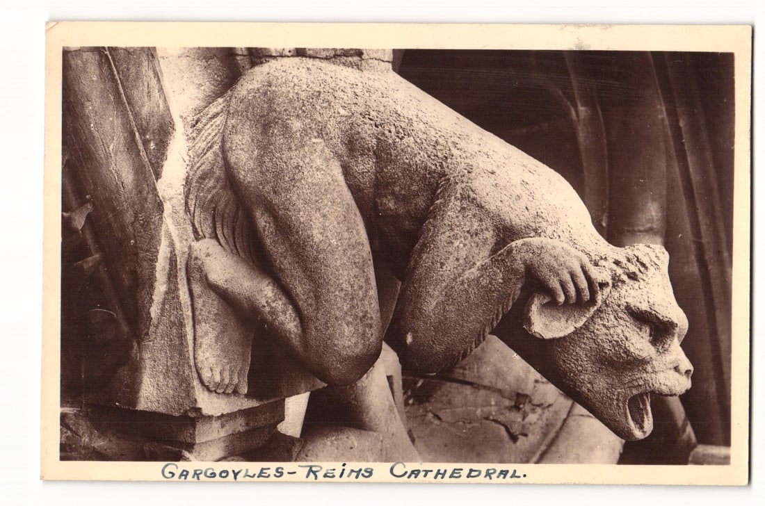 Reims Cathedral Gargoyle, Close-up of Architectural Detail, Sepia Photograph Postcard, P. 81: A sepia-toned photographic postcard depicting a close-up view of a gargoyle on Reims Cathedral. The gargoyle is shown in profile, facing right, with its body crouched and its mouth open in a snarl. It