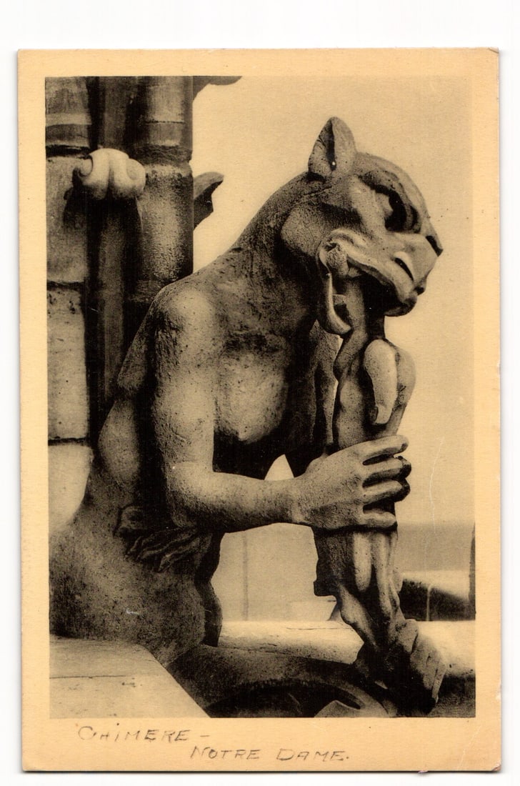 Chimera Sculpture, Notre Dame Cathedral, Paris. Sepia Photographic Postcard. MONUMENTS HISTORIQUES: A sepia-toned photographic postcard depicting a close-up, right-profile view of a chimera sculpture. The creature, with feline features and a beak-like snout, is shown gripping a vertical architectura