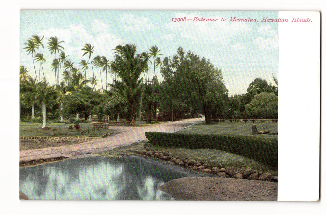 Entrance to Moanalua, Hawaiian Islands. Scenic Landscape Postcard. Honolulu Photo Supply Co.: A colorized image depicting the entrance to Moanalua in the Hawaiian Islands. The foreground features a calm body of water reflecting the sky, with a stone-lined bank on the right and a sandy or grave