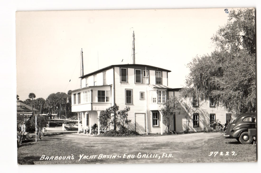 RPPC Postcard: Barbour's Yacht Basin building, Eau Gallie, FL with moored boats, vintage auto: Please view photos for further description and condition considerations. Please know the scans may be darker or lighter than the actual card's true appearance. FREE SHIPPING POLICY: (Domestic USA Only