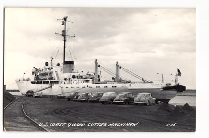 U.S. Coast Guard Cutter Mackinaw Docked with 1950s Cars, c. 1950s L.L. Cook Co. RPPC Postcard