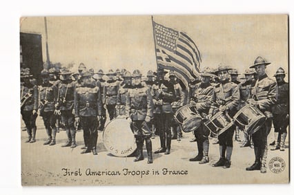 WWI postcard by Chicago Daily News, "First American Troops in France" with AEF drum corps & flag