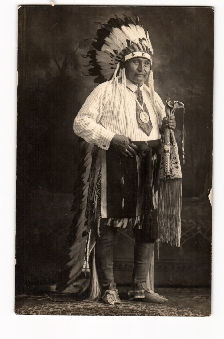 RPPC Postcard of Chief Firestone of the Ponca Tribe in Full Headdress Regalia, c. 1910s Oklahoma: Please view photos for further description and condition considerations. Please know the scans may be darker or lighter than the actual card's true appearance. ACME Auctions offers FREE DOMESTIC SHIPP