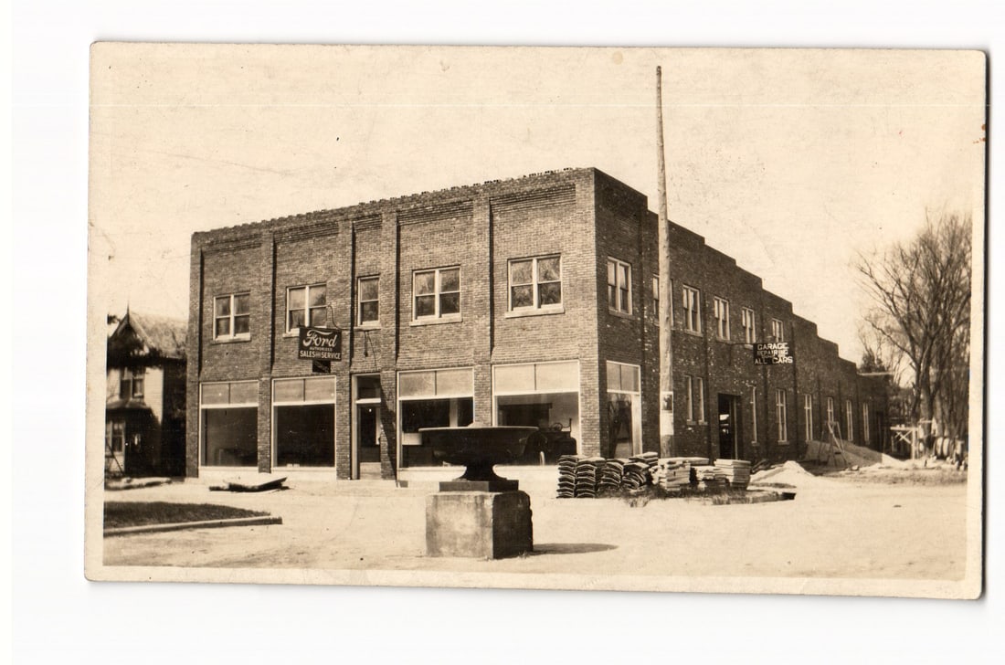 RPPC Real Photo Postcard of a Ford Sales & Service dealership and auto repair garage, c. 1920s.: Please view photos for further description and condition considerations. Please know the scans may be darker or lighter than the actual card's true appearance. ACME Auctions offers FREE DOMESTIC SHIPP