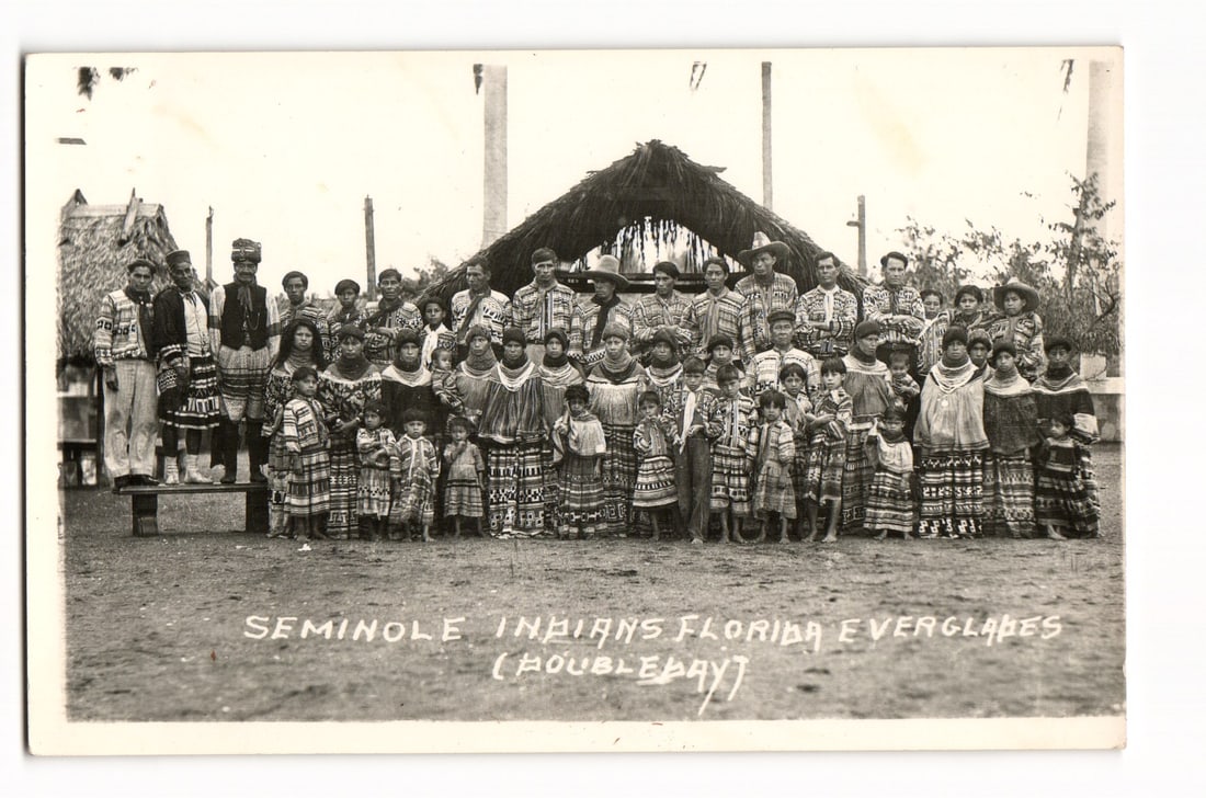 RPPC Real Photo Postcard of a large group of Seminole Indians in the Florida Everglades, Doubleday: Please view photos for further description and condition considerations. Please know the scans may be darker or lighter than the actual card's true appearance. ACME Auctions offers FREE DOMESTIC SHIPP