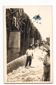 RPPC Real Photo Postcard of workers building a large concrete dam or bridge with scaffolding, 1910s