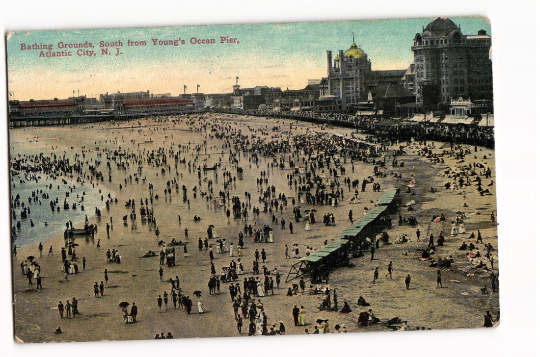 Postcard view of the crowded Bathing Grounds south from Young's Ocean Pier, Atlantic City, NJ: Please view photos for further description and condition considerations. Please know the scans may be darker or lighter than the actual card's true appearance. ACME Auctions offers FREE DOMESTIC SHIPP